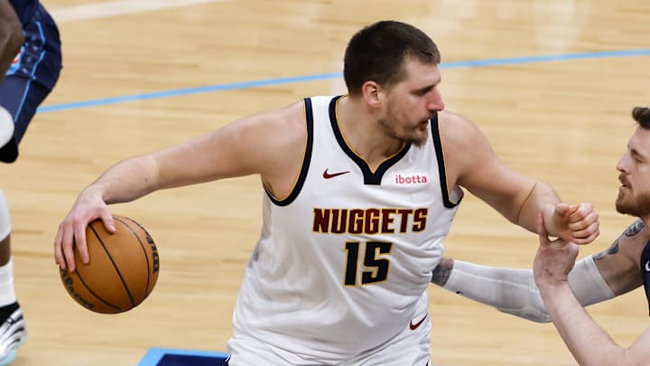 Feb 27, 2026; Oklahoma City, Oklahoma, USA; Denver Nuggets center Nikola Jokić (15) drives against Oklahoma City Thunder center/forward Isaiah Hartenstein (55) during the second quarter at Paycom Center.