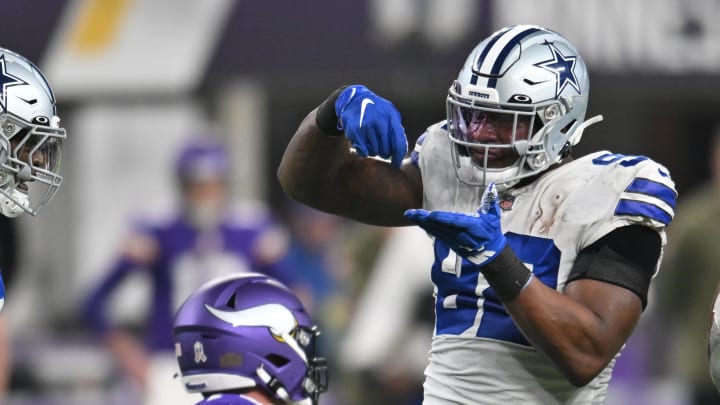 Nov 20, 2022; Minneapolis, Minnesota, USA; Dallas Cowboys defensive end Dorance Armstrong (right) reacts with defensive end DeMarcus Lawrence (left) against the Minnesota Vikings during the third quarter at U.S. Bank Stadium. Mandatory Credit: Jeffrey Becker-USA TODAY Sports