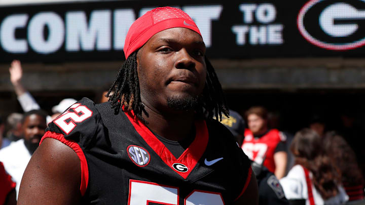 Georgia defensive lineman Christen Miller (52) arrives with the team before the start of the G-Day spring football game in Athens, Ga., on Saturday, April 13, 2024.