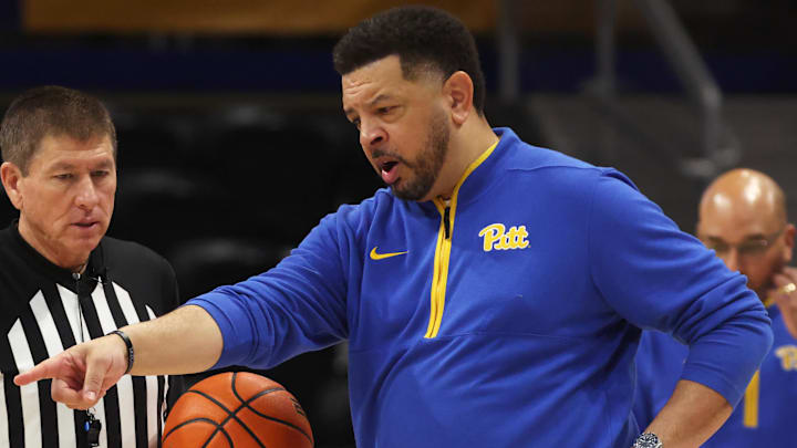 Mar 4, 2026; Pittsburgh, Pennsylvania, USA;  Pittsburgh Panthers head coach Jeff Capel (right) gestures to referee Tony Padilla against the Florida State Seminoles during the second half at the Petersen Events Center. Mandatory Credit: Charles LeClaire-Imagn Images