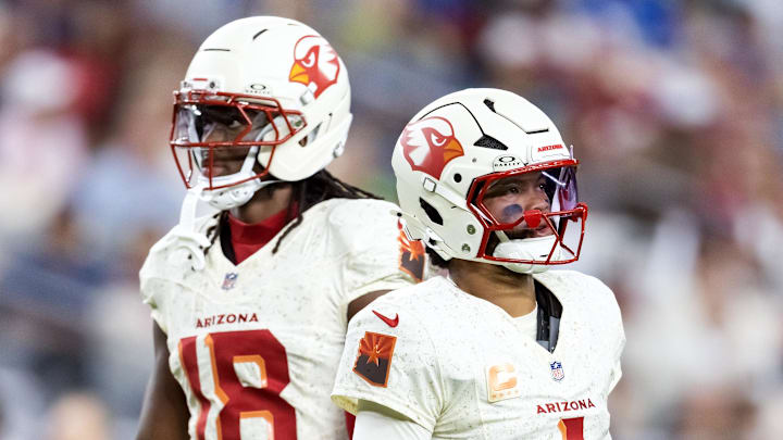 Sep 25, 2025; Glendale, Arizona, USA; Arizona Cardinals quarterback Kyler Murray (1) with wide receiver Marvin Harrison Jr. (18) against the Seattle Seahawks at State Farm Stadium. Mandatory Credit: Mark J. Rebilas-Imagn Images