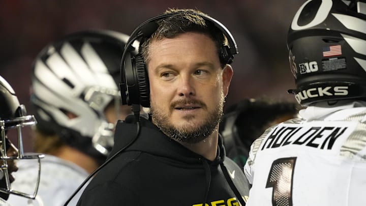 Nov 16, 2024; Madison, Wisconsin, USA;  Oregon Ducks head coach Dan Lanning looks on during the third quarter against the Wisconsin Badgers at Camp Randall Stadium. Mandatory Credit: Jeff Hanisch-Imagn Images