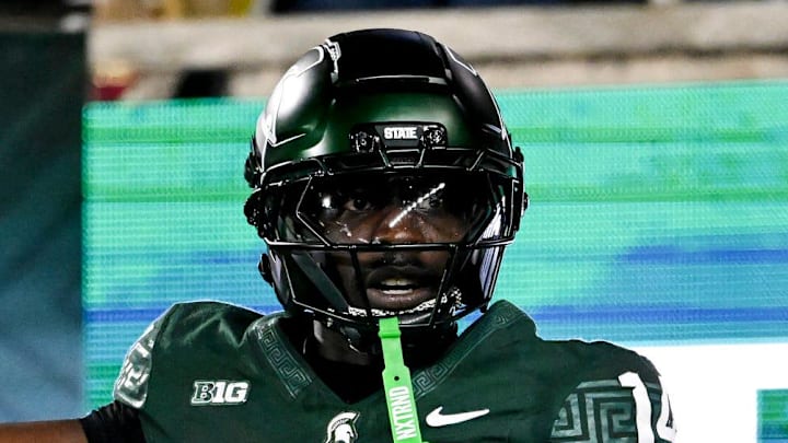 Michigan State's Malcolm Bell, right, reacts after getting called for pass interference against Michigan's Andrew Marsh during the first quarter on Saturday, Oct. 25, 2025, at Spartan Stadium in East Lansing.