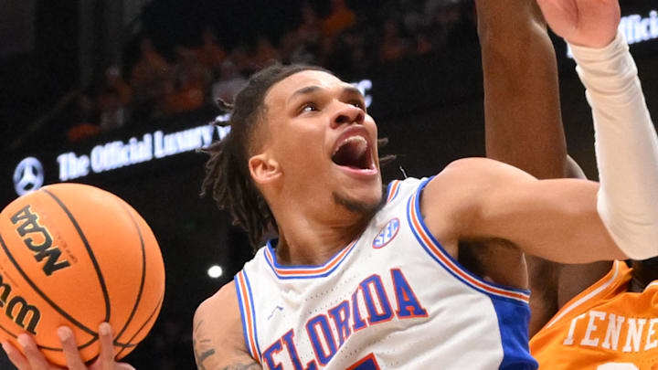 Mar 16, 2025; Nashville, TN, USA; Florida Gators guard Will Richard (5) shoots the ball over Tennessee Volunteers forward Felix Okpara (34) in the first half during the 2025 SEC Championship Game at Bridgestone Arena. Mandatory Credit: Steve Roberts-Imagn Images