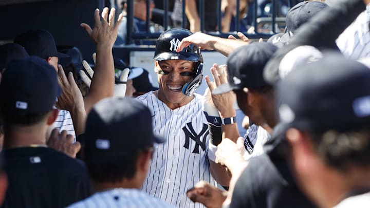 Feb 21, 2026; Tampa, Florida, USA; New York Yankees outfielder Aaron Judge (99) celebrates a home run in the dugout against the Detroit Tigers during the third inning in a Spring Training game at George M. Steinbrenner Field. Mandatory Credit: Morgan Tencza-Imagn Images