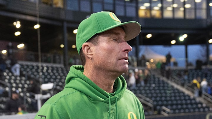 Oregon baseball coach Mark Wasikowski joins his team after defeating Toledo at PK Park in Eugene Friday, Feb. 14, 2025.