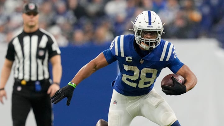 Indianapolis Colts running back Jonathan Taylor (28) is brought down by Jacksonville Jaguars safety Darnell Savage (6) on Sunday, Jan. 5, 2025, during a game against the Jacksonville Jaguars at Lucas Oil Stadium in Indianapolis.