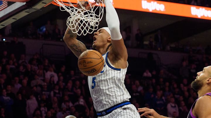 Mar 7, 2026; Minneapolis, Minnesota, USA; Orlando Magic forward Paolo Banchero (5) dunks on the Minnesota Timberwolves in the first quarter at Target Center. Mandatory Credit: Matt Blewett-Imagn Images