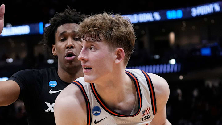 Xavier guard Dailyn Swain (3) guards Illinois guard Kasparas Jakucionis (32) during the second half of their first round NCAA men’ s basketball tournament game on Friday March 21, 2025 at Fiserv Forum in Milwaukee, Wis.
