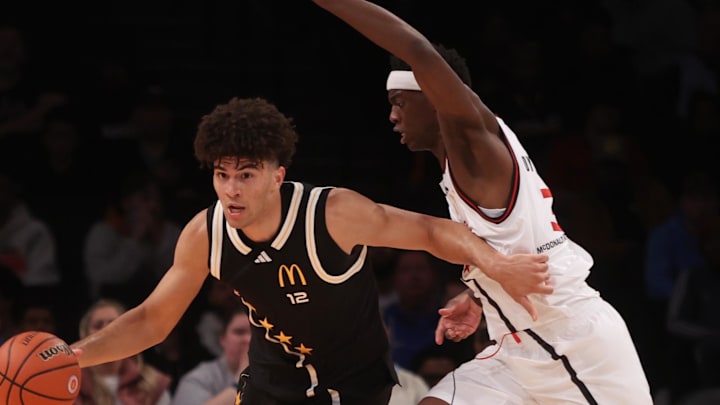 Apr 1, 2025; Brooklyn, NY, USA; McDonald's All American East forward Cameron Boozer (12) dribbles the ball against McDonald's All American West forward AJ Dybantsa (3) during the second half of the game at Barclays Center. Mandatory Credit: Pamela Smith-Imagn Images Apr 1, 2025; Brooklyn, NY, USA; McDonald's All American East forward Cameron Boozer (12) dribbles the ball against McDonald's All American West forward AJ Dybantsa (3) during the second half of the game at Barclays Center. Mandatory Credit: Pamela Smith-Imagn Images