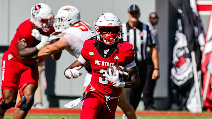 Oct 4, 2025; Raleigh, North Carolina, USA;  NC State Wolfpack running back Hollywood Smothers (3) runs with the ball during the first half of the game against Campbell Fighting Camels at Carter-Finley Stadium. Mandatory Credit: Jaylynn Nash-Imagn Images