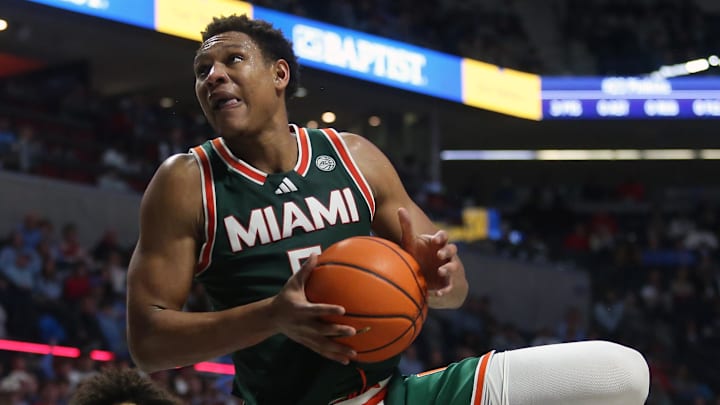 Dec 2, 2025; Oxford, Mississippi, USA; Miami Hurricanes forward Malik Reneau (5) drives to the basket during the first half against the Mississippi Rebels at The Sandy and John Black Pavilion at Ole Miss. Mandatory Credit: Petre Thomas-Imagn Images Dec 2, 2025; Oxford, Mississippi, USA; Miami Hurricanes forward Malik Reneau (5) drives to the basket during the first half against the Mississippi Rebels at The Sandy and John Black Pavilion at Ole Miss. Mandatory Credit: Petre Thomas-Imagn Images