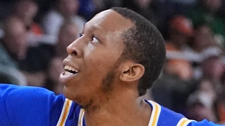 Mar 20, 2025; Providence, RI, USA; McNeese State Cowboys guard Quadir Copeland (11) reaches for a loose ball against Clemson Tigers guard Jaeden Zackery (11) and center Viktor Lakhin (0) during the first half at Amica Mutual Pavilion. Mandatory Credit: Gregory Fisher-Imagn Images
