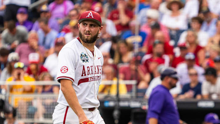 Jun 14, 2025; Omaha, Neb, USA; Arkansas Razorbacks starting pitcher Zach Root (33) walks off the mound during the second inning against the LSU Tigers at Charles Schwab Field. Mandatory Credit: Dylan Widger-Imagn Images