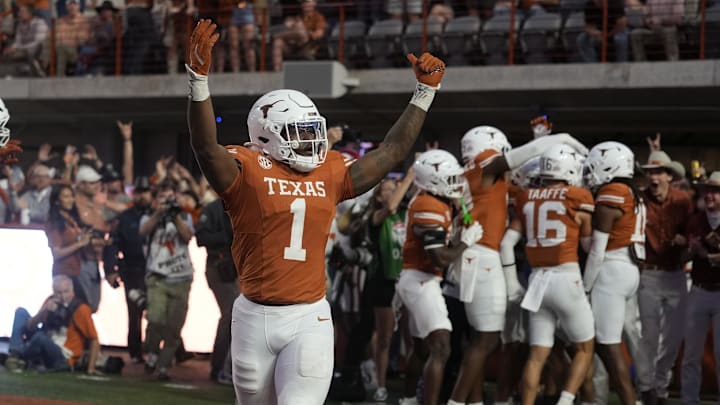 Texas Longhorns defensive lineman Colin Simmons reacts after a fumble was recovered for a touchdown during the second half against the Arkansas Razorbacks at Darrell K Royal-Texas Memorial Stadium.