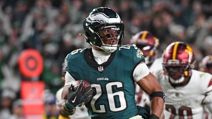 Nov 14, 2024; Philadelphia, Pennsylvania, USA; Philadelphia Eagles running back Saquon Barkley (26) runs past Washington Commanders defenders on way to a 39-yard touchdown during the fourth quarter against the Washington Commanders at Lincoln Financial Field. Mandatory Credit: Eric Hartline-Imagn Images
