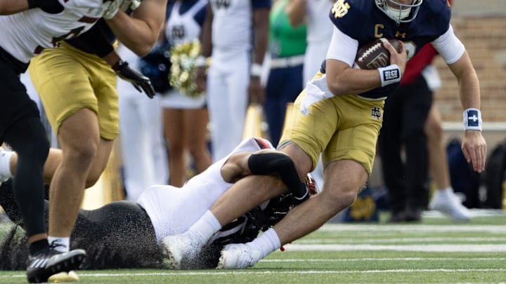 Northern Illinois safety Santana Banner tackles Notre Dame quarterback Riley Leonard during a NCAA college football game between Notre Dame and Northern Illinois at Notre Dame Stadium on Saturday, Sept. 7, 2024, in South Bend.