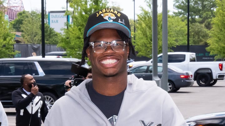 The Jacksonville Jaguars first-round pick, Colorado Buffaloes wide receiver and defensive back Travis Hunter, right, was all smiles as he arrived on Friday, March 25, 2025 at Miller Electric Center in Jacksonville, Fla. The team traded up from fifth to second after making a deal with the Cleveland Browns on Thursday night. The Jaguars held a press conference to introduce the rookie with general manager James Gladstone and head coach Liam Coen and Jaguars owner Shahid Khan. [Doug Engle/Florida
