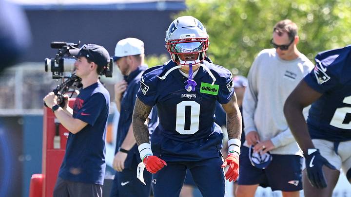 Jul 23, 2025; Foxborough, MA, USA; New England Patriots cornerback Christian Gonzalez (0) warms up before drills during day one of training camp at Gillette Stadium. Mandatory Credit: Eric Canha-Imagn Images Jul 23, 2025; Foxborough, MA, USA; New England Patriots cornerback Christian Gonzalez (0) warms up before drills during day one of training camp at Gillette Stadium. Mandatory Credit: Eric Canha-Imagn Images