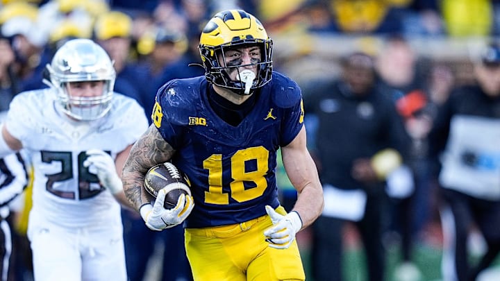 Michigan tight end Colston Loveland (18) runs against Oregon linebacker Bryce Boettcher (28) during the first half at Michigan Stadium in Ann Arbor on Saturday, Nov. 2, 2024.