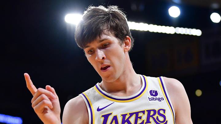 Dec 25, 2023; Los Angeles, California, USA; Los Angeles Lakers guard Austin Reaves (15) reacts after drawing a foul against the Boston Celtics during the first half at Crypto.com Arena. Mandatory Credit: Gary A. Vasquez-Imagn Images