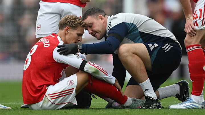 Martin Ødegaard (left) was forced off on Saturday.