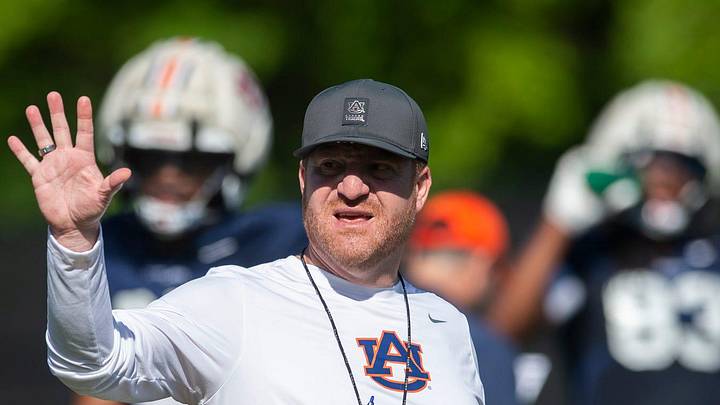 Auburn Tigers head coach Alex Golesh talks with his team during practice at Woltosz Football Performance Center in Auburn, Ala. on Thursday, April 16, 2026.