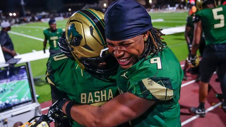 Basha linebacker Marc Duerson III (9) hugs safety Kyser Wilson (0) after a Wilson interception against Chandler during a game at Basha High School in Chandler on Aug. 29, 2026. The Bears travel to California to face Orange Lutheran on Friday.