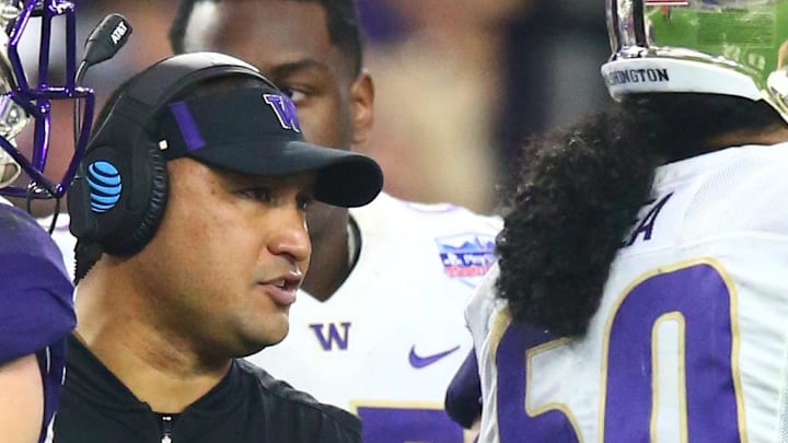 Dec 30, 2017; Glendale, AZ, USA; Washington Huskies defensive line coach Ikaika Malloe (center) against the Penn State Nittany Lions in the 2017 Fiesta Bowl at University of Phoenix Stadium. Mandatory Credit: Mark J. Rebilas-Imagn Images Dec 30, 2017; Glendale, AZ, USA; Washington Huskies defensive line coach Ikaika Malloe (center) against the Penn State Nittany Lions in the 2017 Fiesta Bowl at University of Phoenix Stadium. Mandatory Credit: Mark J. Rebilas-Imagn Images