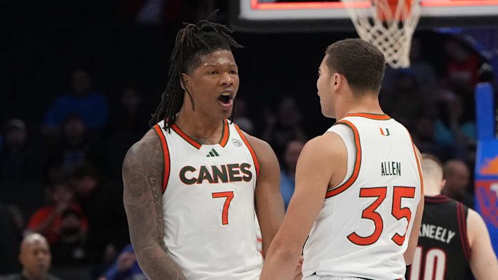 Mar 12, 2026; Charlotte, NC, USA; Miami (FL) Hurricanes forward Shelton Henderson (7) and guard Dante Allen (35) celebrate at the end of the game at Spectrum Center. Mandatory Credit: Bob Donnan-Imagn Images