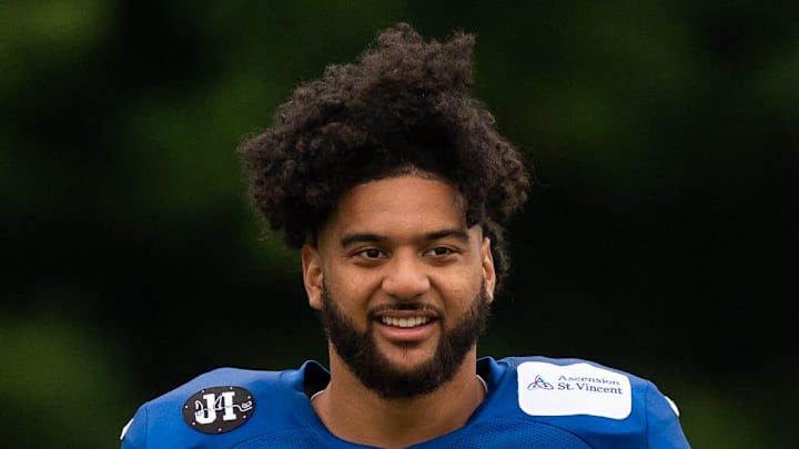 Indianapolis Colts defensive end Jaylahn Tuimoloau prepares for stretches