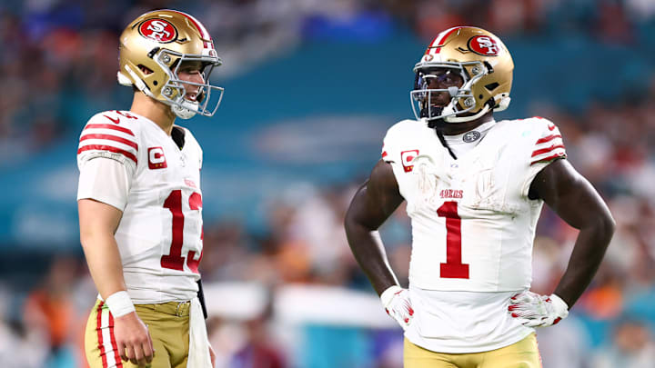 San Francisco 49ers quarterback Brock Purdy (L) and Deebo Samuel (R)