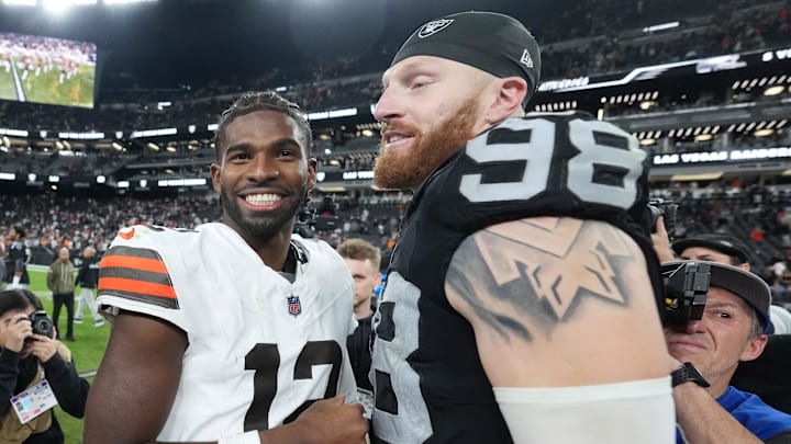 Nov 23, 2025; Paradise, Nevada, USA; Las Vegas Raiders defensive end Maxx Crosby (98) and Cleveland Browns quarterback Shedeur Sanders (12) embrace after the game at Allegiant Stadium. Mandatory Credit: Kirby Lee-Imagn Images