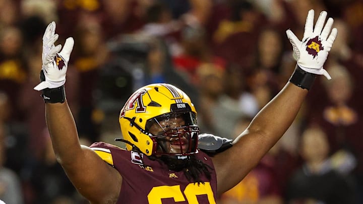 Oct 5, 2024; Minneapolis, Minnesota, USA; Minnesota Golden Gophers offensive lineman Aireontae Ersery (69) celebrates quarterback Max Brosmer's (16) touchdown against the USC Trojans during the first half at Huntington Bank Stadium. Mandatory Credit: Matt Krohn-Imagn Images Oct 5, 2024; Minneapolis, Minnesota, USA; Minnesota Golden Gophers offensive lineman Aireontae Ersery (69) celebrates quarterback Max Brosmer's (16) touchdown against the USC Trojans during the first half at Huntington Bank Stadium. Mandatory Credit: Matt Krohn-Imagn Images