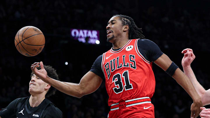 Feb 9, 2026; Brooklyn, New York, USA; Chicago Bulls guard Jaden Ivey (31) is fouled by Brooklyn Nets guard Nolan Traore (88) during the first quarter at Barclays Center. Mandatory Credit: Vincent Carchietta-Imagn Images