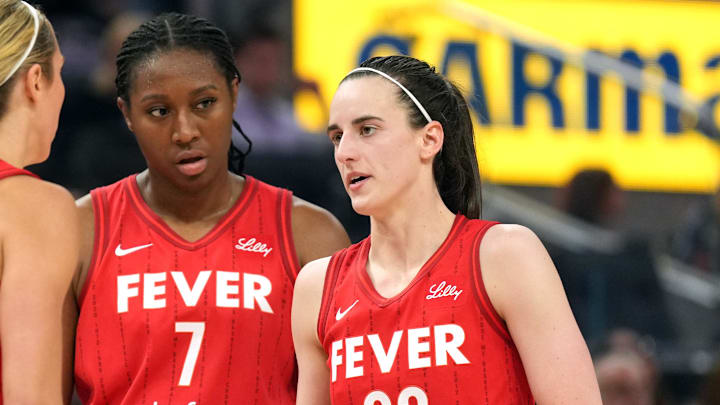 Jun 19, 2025; San Francisco, California, USA; Indiana Fever guard Caitlin Clark (22) talks to guard Lexie Hull (left) and forward Aliyah Boston (7) during the third quarter against the Golden State Valkyries at Chase Center. Mandatory Credit: Darren Yamashita-Imagn Images