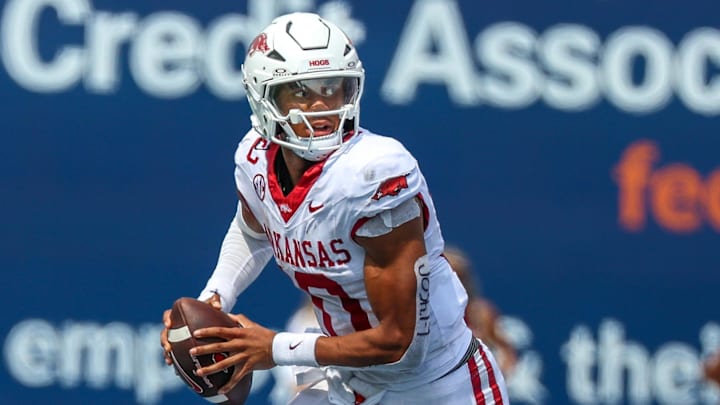 Arkansas Razorbacks quarterback Taylen Green (10) scrambles with the ball against the Memphis Tigers during the second half at Simmons Bank Liberty Stadium.