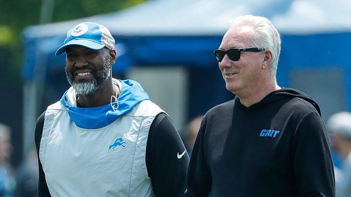 Detroit Lions general manager Brad Holmes talks to president Rod Wood after practice
