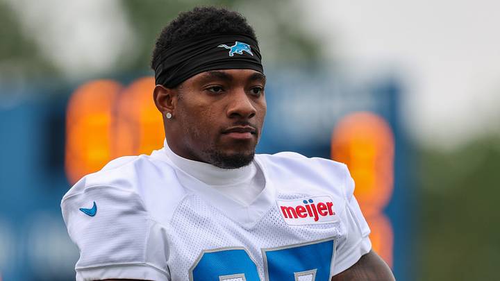 Detroit Lions defensive back Christian Izien (27) looks on during training camp Detroit Lions defensive back Christian Izien (27) looks on during training camp