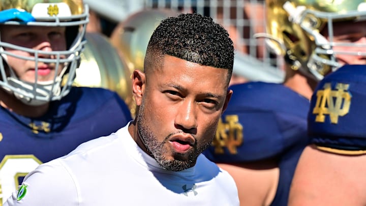 Sep 21, 2024; South Bend, Indiana, USA; Notre Dame Fighting Irish head coach Marcus Freeman prepares to lead his players onto the field for the game against the Miami Redhawks at Notre Dame Stadium.