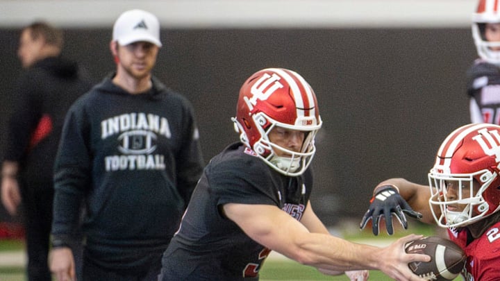 Indiana football quarterbacks coach Chandler Whitmer eyes a drill during spring football practice on Tuesday, April 8, 2025. Indiana football quarterbacks coach Chandler Whitmer eyes a drill during spring football practice on Tuesday, April 8, 2025.