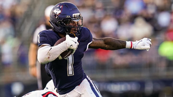 Connecticut Huskies wide receiver Skyler Bell (1) runs the ball against et Ball State Cardinals in the second half at Pratt & Whitney Stadium at Rentschler Field.