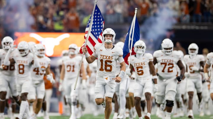 Dec 2, 2023; Arlington, TX, USA; Texas Longhorns quarterback Arch Manning (16) carries out the American flag prior to a game against the Oklahoma State Cowboys at AT&T Stadium. Mandatory Credit: Andrew Dieb-USA TODAY Sports Dec 2, 2023; Arlington, TX, USA; Texas Longhorns quarterback Arch Manning (16) carries out the American flag prior to a game against the Oklahoma State Cowboys at AT&T Stadium. Mandatory Credit: Andrew Dieb-USA TODAY Sports