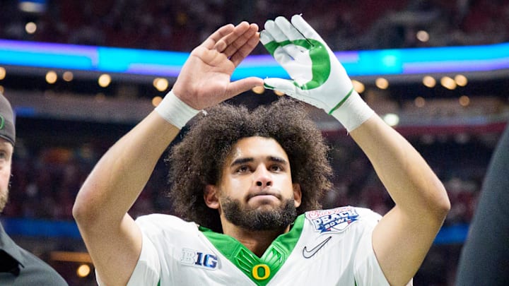 Oregon quarterback Dante Moore walks off the field as the Oregon Ducks face the Indiana Hoosiers in the Peach Bowl on Jan. 9, 2026, at Mercedes-Benz Stadium in Atlanta, Georgia.