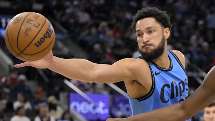 Mar 21, 2025; Inglewood, California, USA;  Los Angeles Clippers guard Ben Simmons (25) steals the ball from Memphis Grizzlies forward Jaren Jackson Jr. (13) in the first half at Intuit Dome. Mandatory Credit: Jayne Kamin-Oncea-Imagn Images