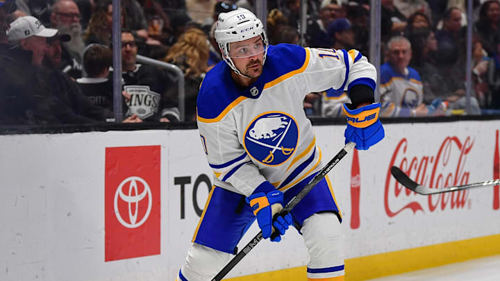 Mar 21, 2026; Los Angeles, California, USA; Buffalo Sabres center Sam Carrick (10) coontrols the puck against the Los Angeles Kings during the third period at Crypto.com Arena. Mandatory Credit: Gary A. Vasquez-Imagn Images