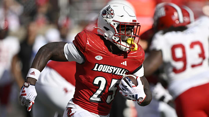 Sep 7, 2024; Louisville, Kentucky, USA; Louisville Cardinals running back Isaac Brown (25) runs the ball against the Jacksonville State Gamecocks during the second half at L&N Federal Credit Union Stadium. Louisville defeated Jacksonville State 49-14. Mandatory Credit: Jamie Rhodes-Imagn Images Sep 7, 2024; Louisville, Kentucky, USA; Louisville Cardinals running back Isaac Brown (25) runs the ball against the Jacksonville State Gamecocks during the second half at L&N Federal Credit Union Stadium. Louisville defeated Jacksonville State 49-14. Mandatory Credit: Jamie Rhodes-Imagn Images