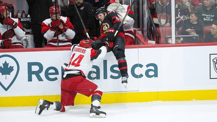 Apr 25, 2026; Ottawa, Ontario, CAN; Ottawa Senators center Lars Eller (89) is checked by Carolina Hurricanes left wing Nicolas Deslauriers (44) in the third period of game four of the first round of the 2026 Stanley Cup Playoffs at the Canadian Tire Centre. Mandatory Credit: Marc DesRosiers-Imagn