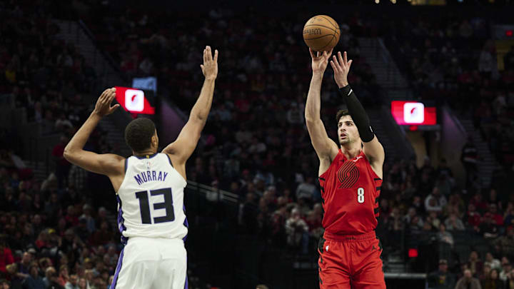 Nov 29, 2024; Portland, Oregon, USA; Portland Trail Blazers forward Deni Avdija (8) shoots a jump shot during the second half against Sacramento Kings forward Keegan Murray (13) at Moda Center. Mandatory Credit: Troy Wayrynen-Imagn Images