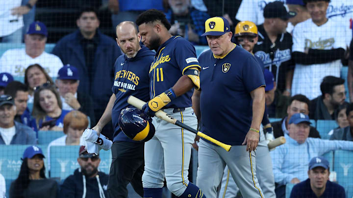 Oct 16, 2025; Los Angeles, California, USA; Milwaukee Brewers center fielder Jackson Chourio (11) is rendered aid by medical staff in the seventh inning during game three of the NLCS round for the 2025 MLB playoffs at Dodger Stadium. Mandatory Credit: Kiyoshi Mio-Imagn Images Oct 16, 2025; Los Angeles, California, USA; Milwaukee Brewers center fielder Jackson Chourio (11) is rendered aid by medical staff in the seventh inning during game three of the NLCS round for the 2025 MLB playoffs at Dodger Stadium. Mandatory Credit: Kiyoshi Mio-Imagn Images